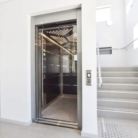 Commercial Stretcher lift with automatic sliding cabin and landing doors, 1000kg load capacity.